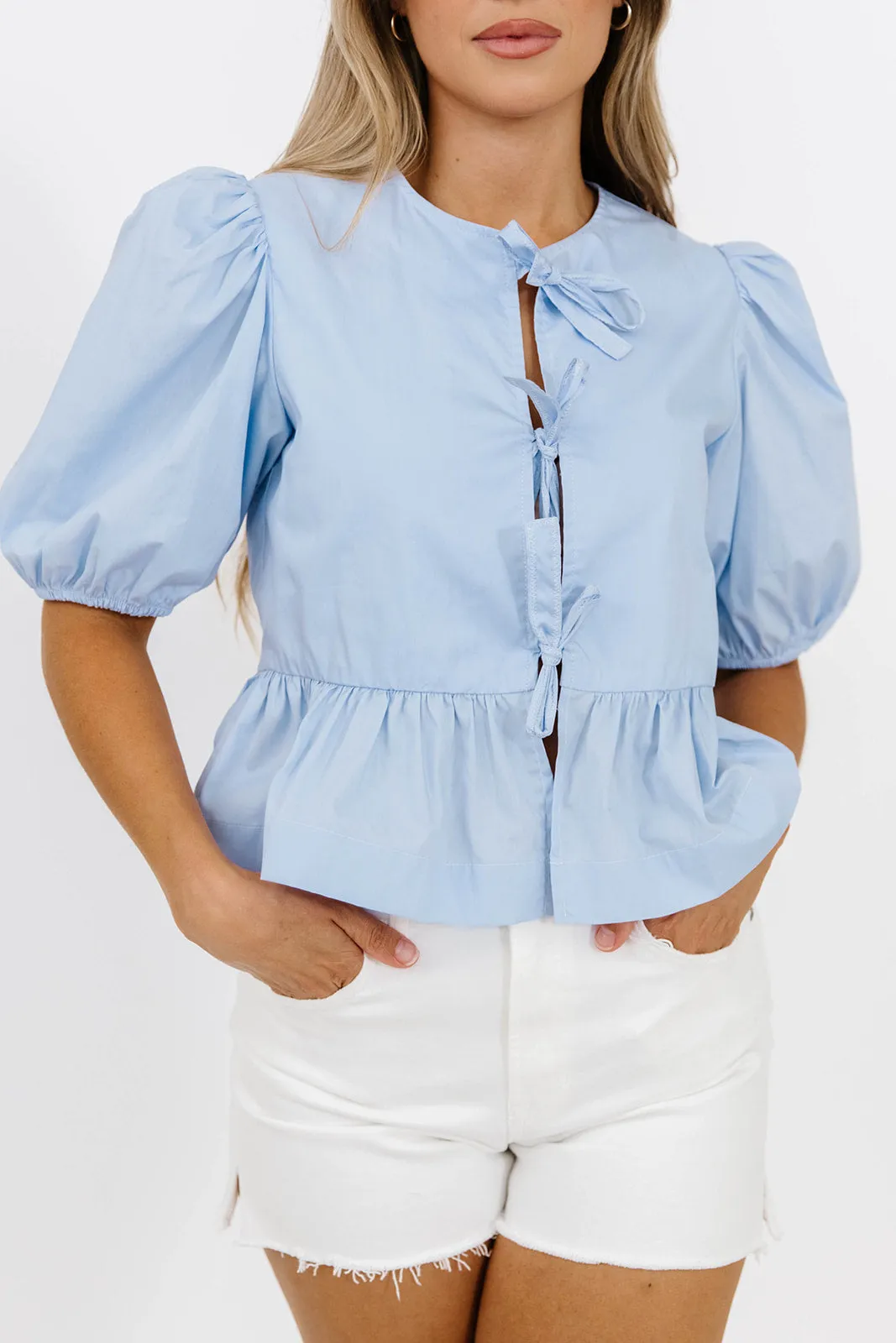 Low Maintenance Fibers Odor Resistant Fabric Mabel Knot Detail Peplum Top in Blue *Final-Sale*